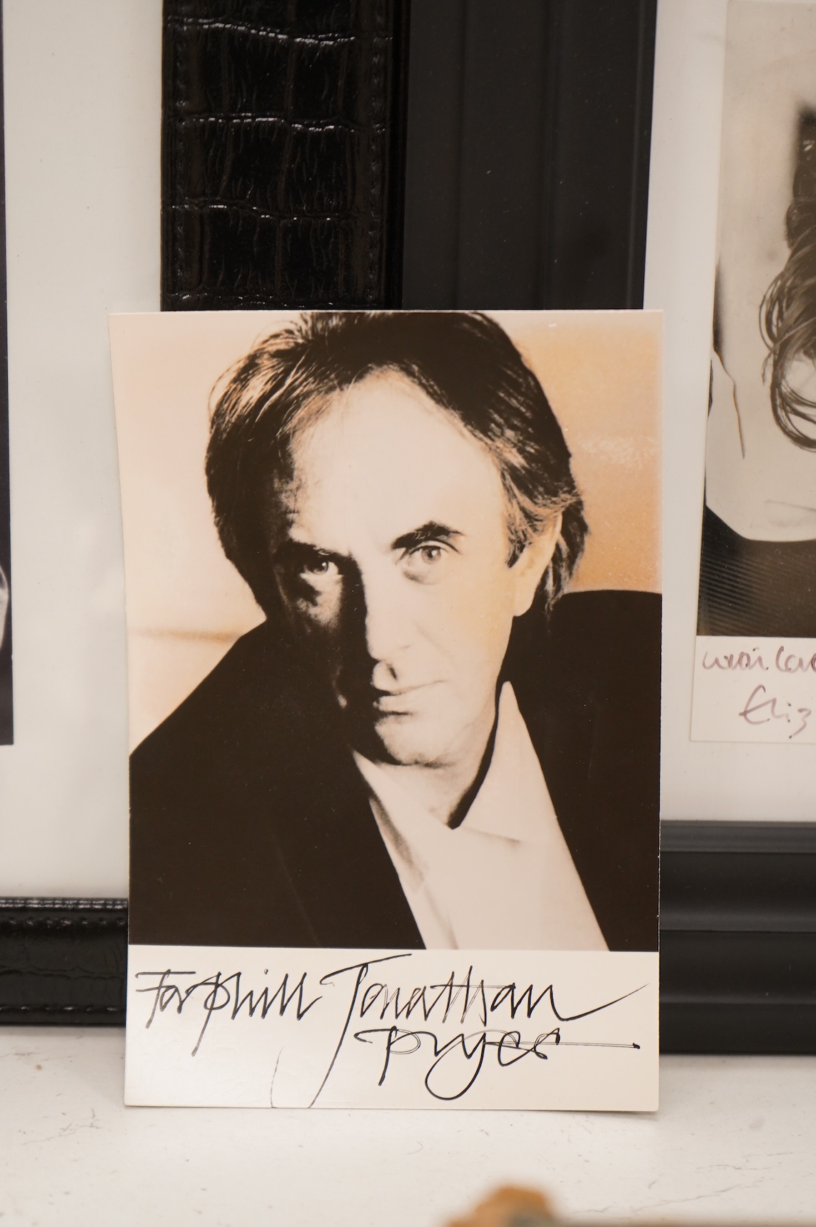 Four signed photographs to include, John Gielgud, Jonathan Pryce and Elizabeth Hurley, largest 28cm high